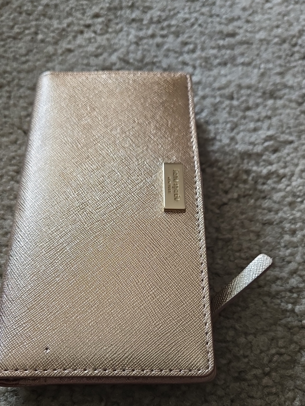 kate spade Rose Giold wallet with gold-tone hardware